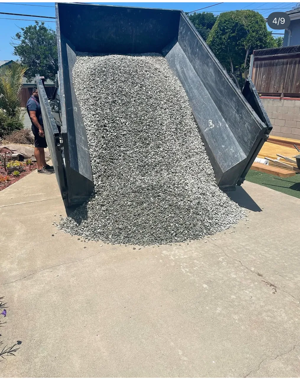Roll-off containers loaded on a trailer, ready for delivery to a San Diego job site
